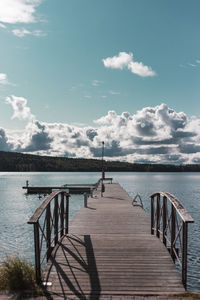 Pier over sea against sky