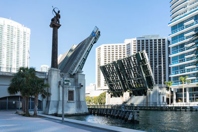 Walking among the skyscrapers in downtown miami during a sunny day