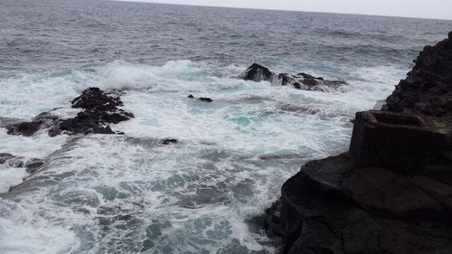 Waves splashing on rocks