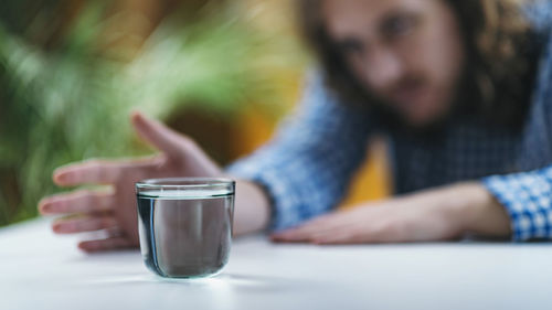 Telekinesis. practicing telekinetic powers with glass of water