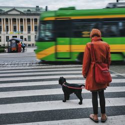 Woman standing on city street