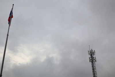 Low angle view of communications tower against sky