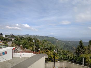 High angle view of trees and buildings against sky