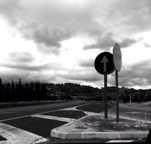 Road against cloudy sky