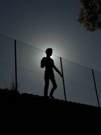 Silhouette of man standing at night