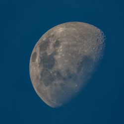 Close-up of moon against blue sky