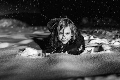 Portrait of girl lying on swimming pool