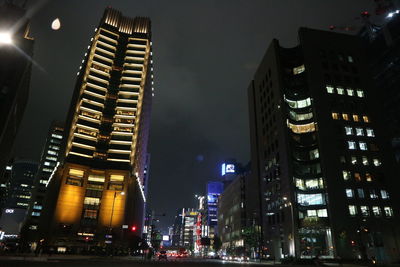 Low angle view of modern building at night