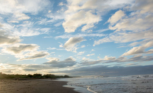 Scenic view of beach against sky during sunset