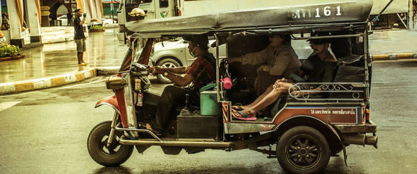 People working on street in city