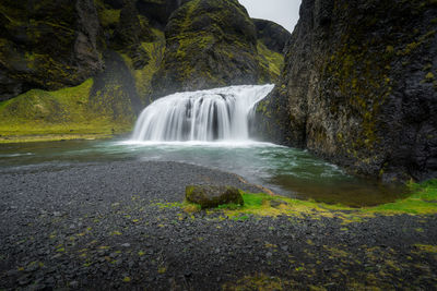 View of waterfall in forest