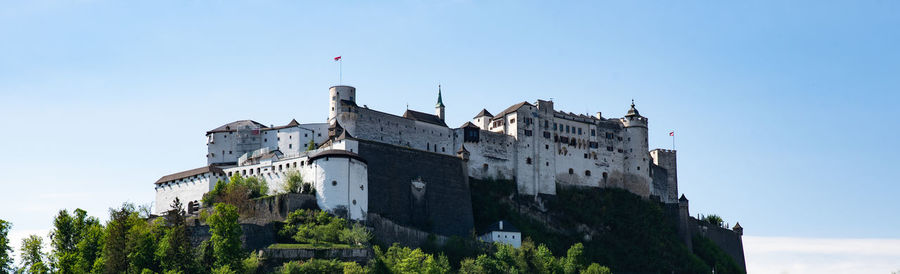 Low angle view of castle hohensalzburg against sky