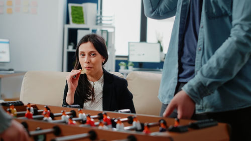 Side view of businesswoman working at office