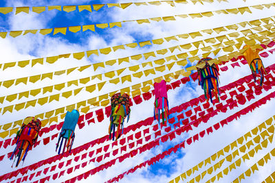 Low angle view of multi colored flags