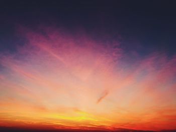 Low angle view of dramatic sky during sunset