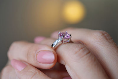 Close-up of hand holding ring