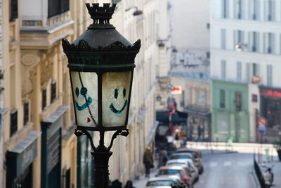 Smiley face on street light