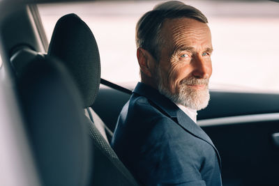 Portrait of man in car