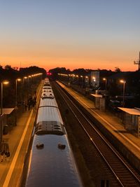 High angle view of railroad station against sky during sunset