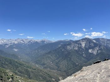 Scenic view of mountains against clear blue sky