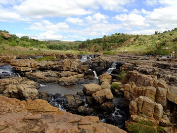 Scenic view of rocks against sky