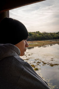 Portrait of young man looking at sea