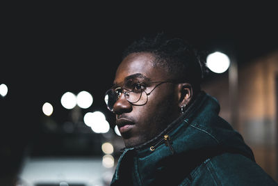 Portrait of young man looking away