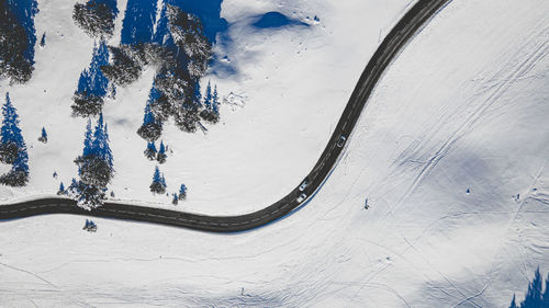 High angle view of people on snow covered mountain