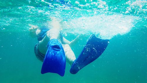 Woman swimming in sea