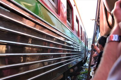 Rear view of woman on train at railroad station