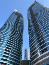 Low angle view of modern buildings against clear sky