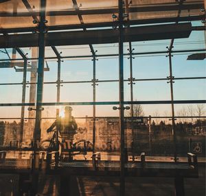 Reflection of man on glass window