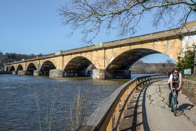 View of bridge over river against clear sky