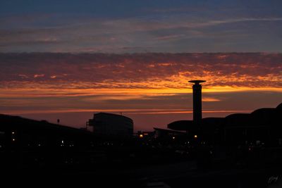 Built structures against sky during sunset