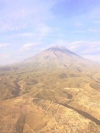 Aerial view of volcanic landscape against sky