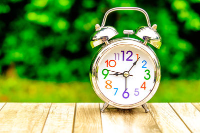 Close-up of alarm clock on table