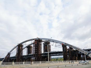 Low angle view of amusement park against sky