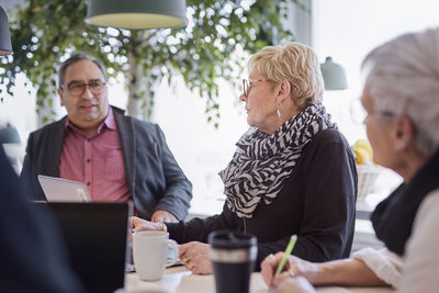 People taking during business meeting