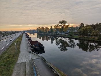 High angle view of bridge over river against sky during sunset