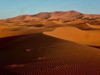 Scenic view of desert against clear sky