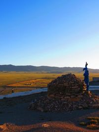 View of landscape against clear blue sky