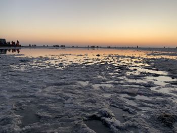 Scenic view of sea against clear sky during sunset