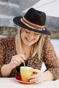 Woman having drink at cafe