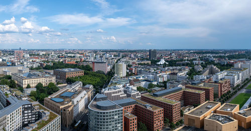 High angle view of buildings in city against sky
