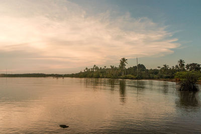 Scenic view of lake against sky during sunset