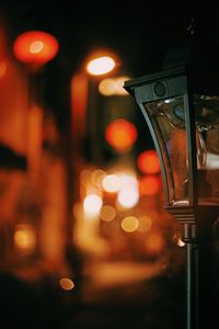 View of illuminated street lights at night