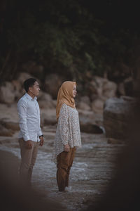 Rear view of couple on the beach