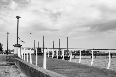 Pier on sea against sky