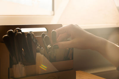 Close-up of hand holding cutlery