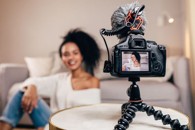 Portrait of woman photographing